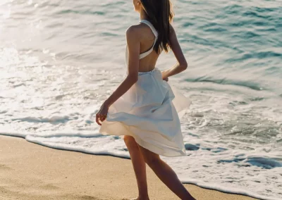 Beautiful woman running along a beach in South Devon
