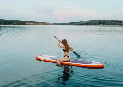 Woman paddleboarding in Devon